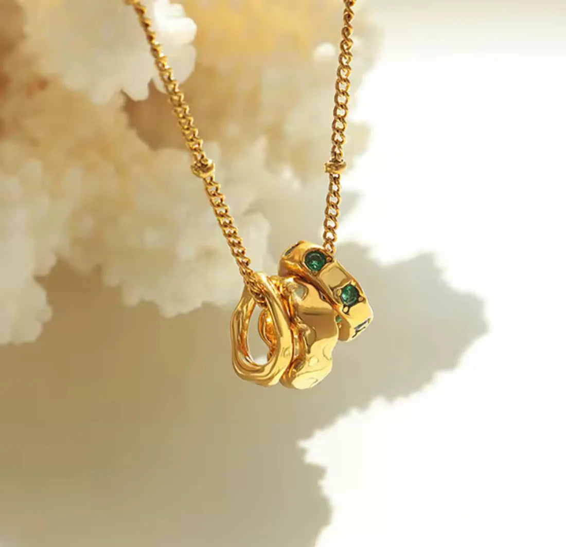 Gold Interlocking Necklace with Emerald Crystal Accents